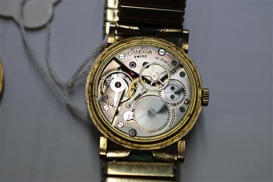 A gentlemans boys size 1930s 9ct gold Omega manual wind wrist watch, on associated strap.